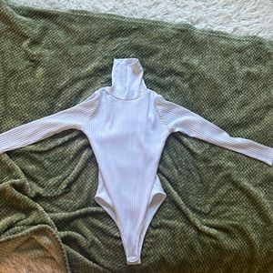 White turtleneck bodysuit.